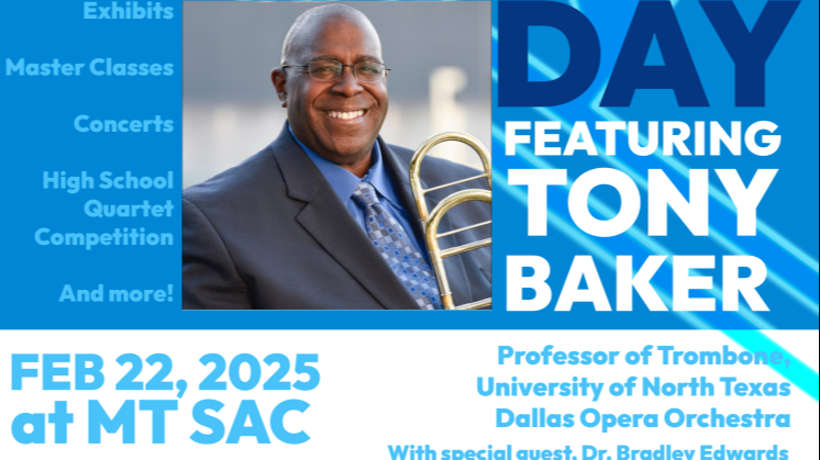 Tony Baker Smiling and holding a trombone